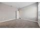 Neutral bedroom with a window, carpeted flooring, and neutral walls at 2110 Old Hollow Ln, Clermont, FL 34715