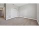 Bedroom with carpet flooring, neutral walls, and double-door closet for optimal storage at 2110 Old Hollow Ln, Clermont, FL 34715