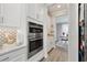 Stainless appliances and backsplash accents give dimension to this home's kitchen at 2110 Old Hollow Ln, Clermont, FL 34715