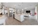 Open concept kitchen with stainless appliances, island and easy access to Gathering room at 2110 Old Hollow Ln, Clermont, FL 34715