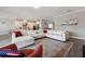 Open-concept living room with tile flooring and a view of the modern kitchen at 2110 Old Hollow Ln, Clermont, FL 34715