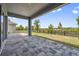 Spacious outdoor patio featuring stone tiling and views of the backyard at 2110 Old Hollow Ln, Clermont, FL 34715