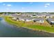 Aerial view showcasing a community with pond views at 2156 Merrybells Dr, Kissimmee, FL 34746