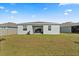 Spacious backyard with patio, perfect for outdoor entertaining and relaxation at 2156 Merrybells Dr, Kissimmee, FL 34746