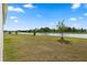 Water view from the backyard featuring a tranquil lake at 2156 Merrybells Dr, Kissimmee, FL 34746