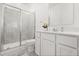 Clean, well-lit bathroom with a tiled shower, toilet, and single vanity at 2156 Merrybells Dr, Kissimmee, FL 34746