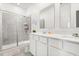 Modern bathroom features dual sinks, a sleek shower, and contemporary fixtures at 2156 Merrybells Dr, Kissimmee, FL 34746