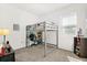 Cozy bedroom with a unique loft bed and desk setup, perfect for study or relaxation at 2156 Merrybells Dr, Kissimmee, FL 34746