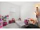 Cozy bedroom featuring a window with blinds and playful decor at 2156 Merrybells Dr, Kissimmee, FL 34746