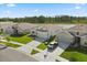 Aerial view of a house with a driveway and lawn; scenic lake backdrop at 2156 Merrybells Dr, Kissimmee, FL 34746
