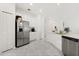 Modern kitchen with stainless steel appliances, white cabinets and modern tile flooring at 2156 Merrybells Dr, Kissimmee, FL 34746