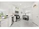 Well-lit kitchen features stainless steel appliances and a cozy breakfast nook at 2156 Merrybells Dr, Kissimmee, FL 34746