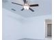 Carpeted bedroom featuring a ceiling fan, neutral walls, and a doorway leading to another room at 2189 Teneroc Trl, Lakeland, FL 33801