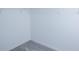 An empty, carpeted walk-in closet with white walls, wire shelving, and ample storage space at 2189 Teneroc Trl, Lakeland, FL 33801