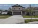 Beautiful two-story home with a well-manicured lawn and a spacious driveway at 2189 Teneroc Trl, Lakeland, FL 33801