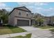 Charming two-story home with a two-car garage and well-maintained lawn and fresh landscaping at 2189 Teneroc Trl, Lakeland, FL 33801