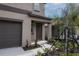 Inviting front entrance with a covered porch, freshly mulched beds and landscaped features at 2189 Teneroc Trl, Lakeland, FL 33801