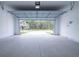 Bright two-car garage with concrete floor and white walls, ready for vehicles and storage solutions at 2189 Teneroc Trl, Lakeland, FL 33801