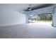 Spacious two-car garage with concrete floor, white walls, and automatic door, offering ample parking and storage at 2189 Teneroc Trl, Lakeland, FL 33801