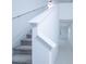 Bright and airy staircase featuring white railings, carpeted steps, and ample natural light at 2189 Teneroc Trl, Lakeland, FL 33801
