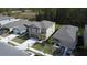 Aerial view of residential street featuring well-maintained lawns and modern two-story houses with driveway parking at 2189 Teneroc Trl, Lakeland, FL 33801