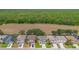 Aerial of homes showing tree line and open land behind homes in this community at 253 Aldridge Ln, Davenport, FL 33897