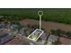 Aerial view of home highlighted in neighborhood with tree lined horizon at 253 Aldridge Ln, Davenport, FL 33897