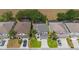 Bird's eye view of home in established neighborhood, showcasing the well manicured lawn and proximity to other houses at 253 Aldridge Ln, Davenport, FL 33897