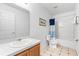 Compact bathroom features a shower-tub combo, toilet, and vanity, offering essential amenities in a functional and well-maintained space at 253 Aldridge Ln, Davenport, FL 33897
