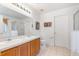 Bathroom featuring double sinks, a shower, and a toilet at 253 Aldridge Ln, Davenport, FL 33897