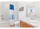 Functional bathroom features a shower-tub combo, toilet, and single vanity, offering essential amenities in a compact space at 253 Aldridge Ln, Davenport, FL 33897