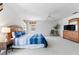 Spacious bedroom with a ceiling fan, a window, and a dresser with a TV at 253 Aldridge Ln, Davenport, FL 33897