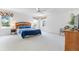 Bright bedroom featuring a large window, a ceiling fan, and a comfortable bed at 253 Aldridge Ln, Davenport, FL 33897