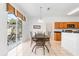 Bright dining area with sliding glass doors leading to outdoor patio and a view of the backyard at 253 Aldridge Ln, Davenport, FL 33897
