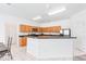 Open kitchen with stainless steel appliances, breakfast bar and tile flooring at 253 Aldridge Ln, Davenport, FL 33897