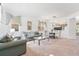 Bright living room featuring neutral carpet, light-colored walls, and stylish furniture, creating an inviting atmosphere at 253 Aldridge Ln, Davenport, FL 33897