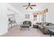 Cozy living room features neutral color scheme, comfortable seating, and stylish decor, creating an inviting space for relaxation at 253 Aldridge Ln, Davenport, FL 33897