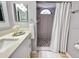 Renovated bathroom featuring a shower with geometric tiles and a modern sink with a quartz countertop at 2714 Rio Grande Trl # 2714, Kissimmee, FL 34741
