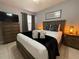 Well-decorated bedroom with a king-size bed, dark furniture, and decorative lamps at 2714 Rio Grande Trl # 2714, Kissimmee, FL 34741