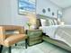 Cozy bedroom featuring modern decor, a comfortable bed, and a stylish side chair at 2714 Rio Grande Trl # 2714, Kissimmee, FL 34741