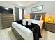 Well-furnished bedroom featuring a comfortable bed, modern decor, and ample closet space at 2714 Rio Grande Trl # 2714, Kissimmee, FL 34741