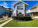 Charming condo with light blue siding, brick accents, and well-maintained landscaping at 2714 Rio Grande Trl # 2714, Kissimmee, FL 34741