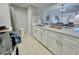 Bright kitchen with white cabinets, stainless steel appliances and an open design at 2714 Rio Grande Trl # 2714, Kissimmee, FL 34741