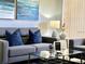 Comfortable living room with gray couch, matching pillows and stylish decor at 2714 Rio Grande Trl # 2714, Kissimmee, FL 34741