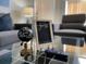 Cozy living room details including a 'guest' sign, decor, and the remote at 2714 Rio Grande Trl # 2714, Kissimmee, FL 34741