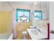 Well-maintained bathroom with a tub and shower combination, a window for natural light at 3122 Eleuthera Ln, Orlando, FL 32827