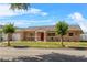 Inviting single-story home featuring a bright red front door and a well-manicured lawn at 3122 Eleuthera Ln, Orlando, FL 32827