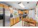 Functional kitchen featuring stainless steel appliances and a cozy dining area with natural light at 3122 Eleuthera Ln, Orlando, FL 32827