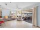 Comfortable living room with sliding glass doors that lead to a cozy covered outdoor patio at 3122 Eleuthera Ln, Orlando, FL 32827