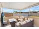 Relaxing outdoor patio with comfortable seating, strung lights, and backyard view at 3122 Eleuthera Ln, Orlando, FL 32827